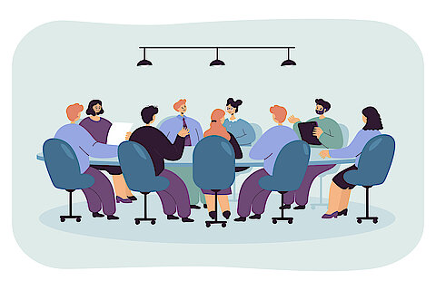 Politician sitting at round table in boardroom