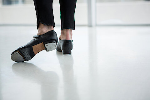 Close-up of dancer wearing tap shoes in the studio