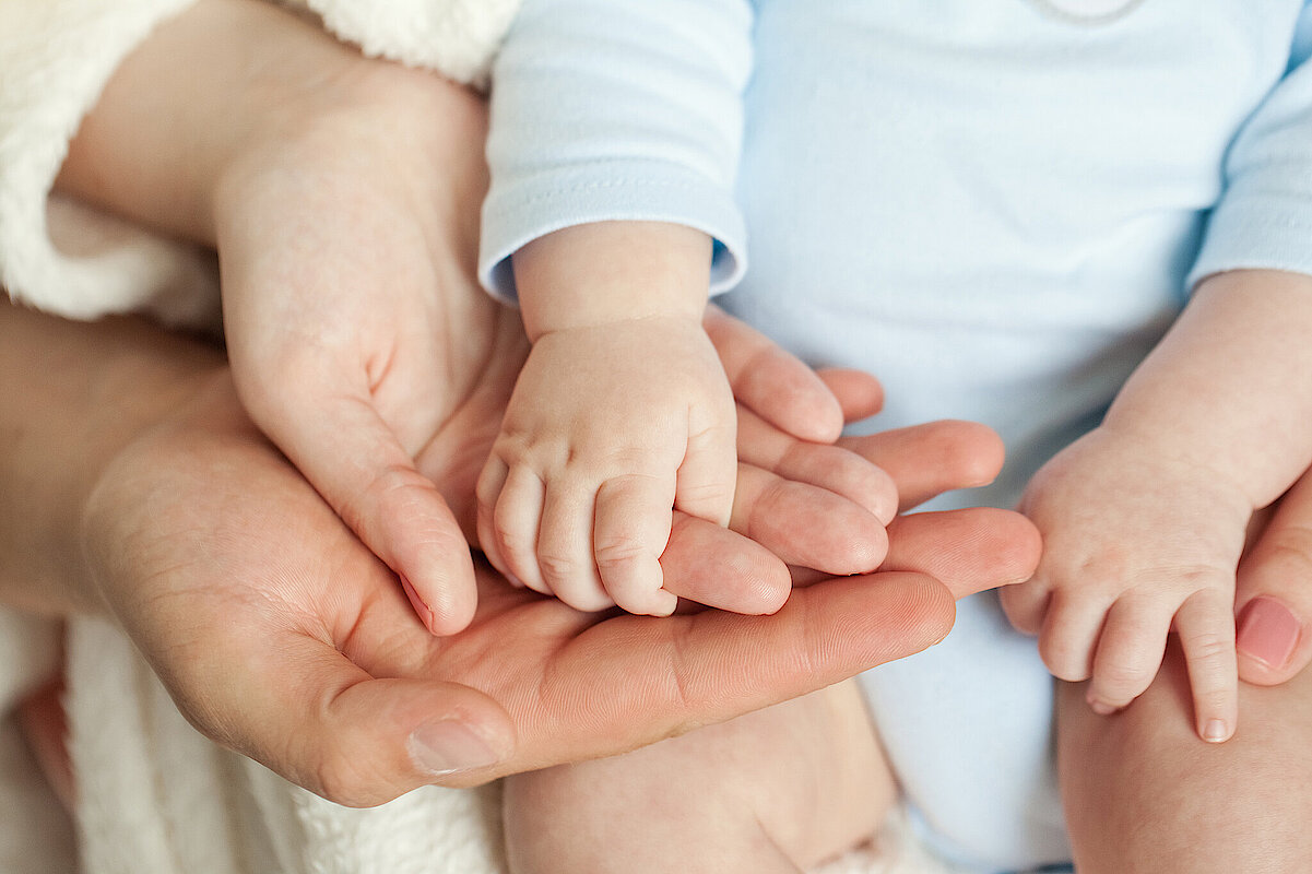 Mom,And,Dad,Hold,Baby's,Hand